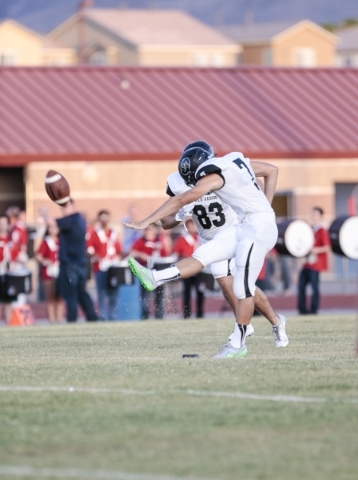 Palo Verde High School Junior Aaron Mack (7) kicks the ball to start the game between the Pa ...