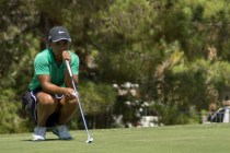 Aubrianna Jordan, a member of the Rancho High School golf team, lines up a putt at The Legac ...