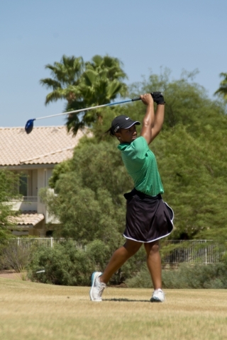 Aubrianna Jordan, a member of the Rancho High School golf team, hits a ball at The Legacy Go ...