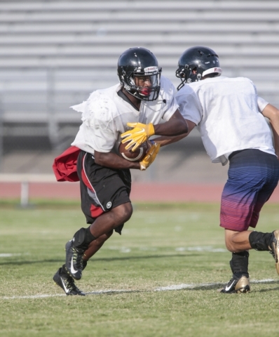Las Vegas High School running back Elijah Hicks runs a drill during football practice at the ...
