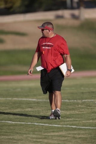 Las Vegas High School Head coach James Thurman watches his players during football practice ...