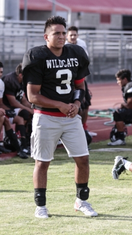 Las Vegas High School linebacker Cruz Littlefield waits during a break at football practice ...