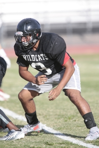 Las Vegas High School linebacker Cruz Littlefield prepares to block during football practice ...