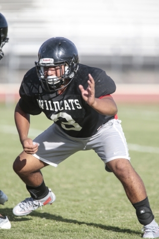 Las Vegas High School linebacker Cruz Littlefield prepares to block during football practice ...