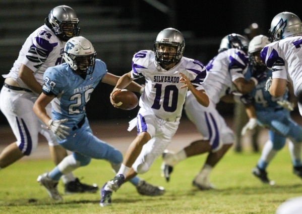Silverado‘s Micah Weber (10) runs the ball against Foothill during a football game at ...