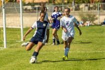 Katherine Ballou (6) of the Foothill Falcons passes the ball to a teammate as Brynna McGinni ...