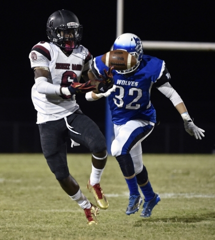 Desert Oasis‘ Zion Jones bobbles the ball against Basic‘s Johnny Tapia during th ...