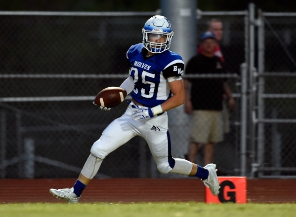 Basic&lsquo;s Jake Waldren runs in the end zone for his first touchdown against Desert Oasis ...