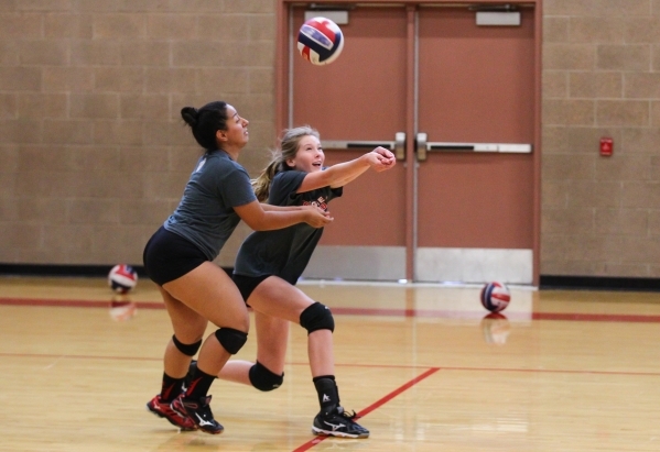 Arbor View middle blocker Alexis Kershaw, right, and libero Alyssa Jeeves look to return bal ...