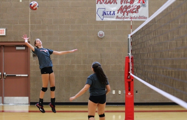 Arbor View outside hitter Sarah Goddard, left, returns the ball during volleyball practice i ...