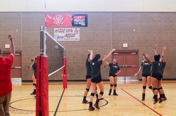 Arbor View volleyball players celebrate during practice in Las Vegas on Tuesday, Sept. 15, 2 ...