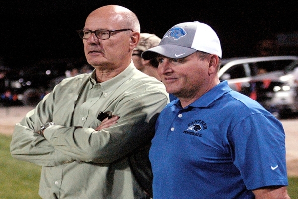 NBC News correspondent Harry Smith, left, stands with Pahranagat Valley football coach Ken H ...