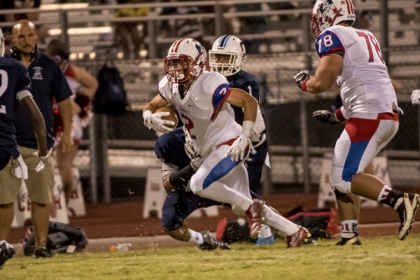 Liberty Patriots wide receiver Ethan Dedeaux (2) runs with the ball against the Centennial B ...
