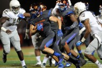 Bishop Gorman running back Biaggio Walsh (7) rushes the ball against Long Beach Poly in the ...