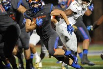Bishop Gorman running back Biaggio Walsh (7) rushes the ball for a first down in the first h ...