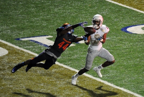 Bishop Gorman defensive back Brendan Radley-Hiles (44) breaks up a pass intended for Long Be ...