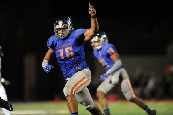 Bishop Gorman defensive lineman Haskell Garrett (16) celebrates a Gorman fumble recovery aga ...