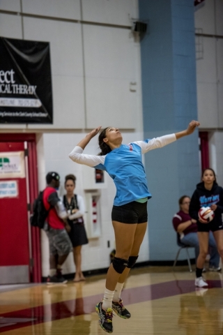 Destiny Gonzalez of Western High School serves the ball against Faith Lutheran High School a ...