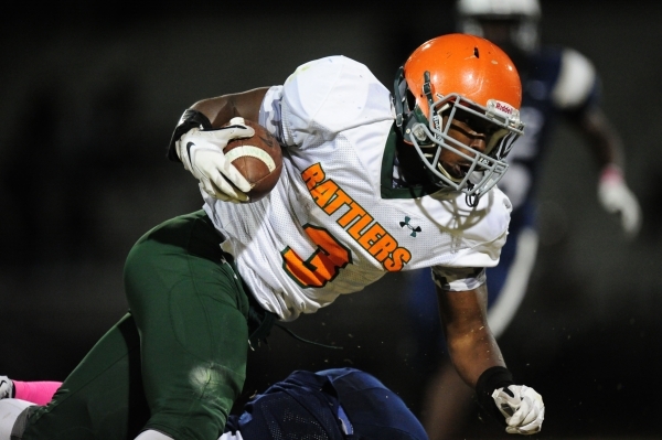 Mojave Rattlers running back Elijah Smoot runs the ball against Spring Valley in the third q ...