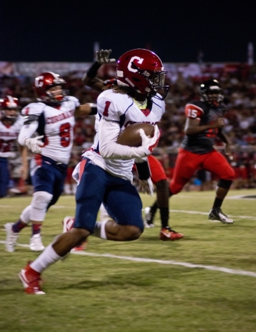 Coronado&lsquo;s DaQu&lsquo;an Davis (1) runs the ball upfield during their prep football ga ...