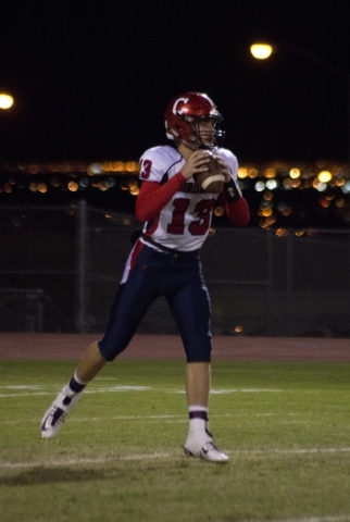Coronado High School quarterback Landen Rowland (13) drops back for a pass during their prep ...