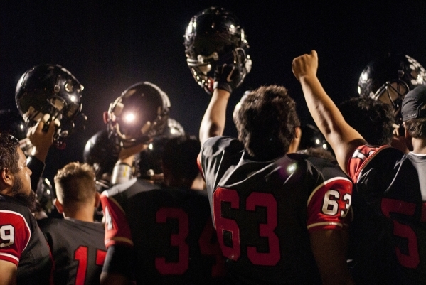 The Las Vegas High School football team celebrates their win after their prep football game ...