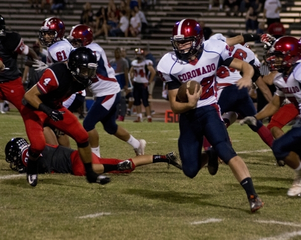 Coronado‘s Walker Wright (32) attempts to move the ball upfield during their prep foot ...