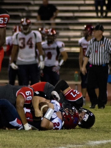 Coronado&lsquo;s Zacari Holbert (24) Las Vegas&lsquo; Alexis Leon Ramirez (66) and Donye Ter ...