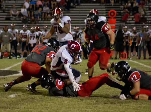 Coronado‘s Andrew St. Clair (8) is tackled during the prep football game at Las Vegas ...