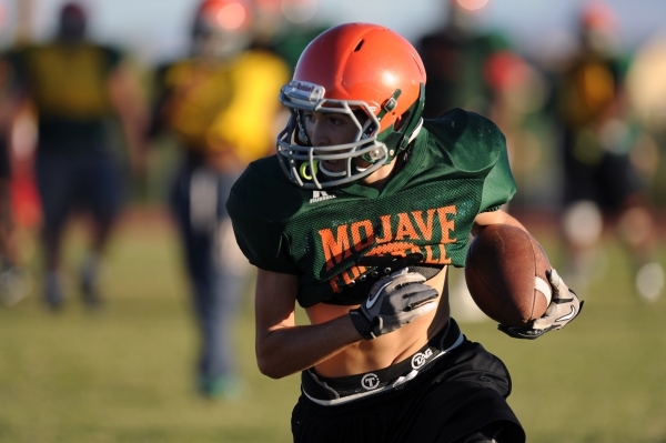 Mojave Rattlers wide receiver Jaylon Delgado looks for running room after making a catch dur ...