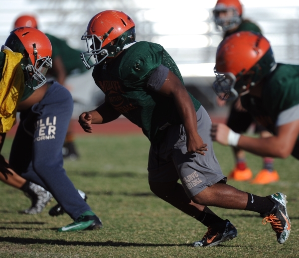 Mojave Rattlers defensive lineman Daijon Payno comes off the line during football practice a ...