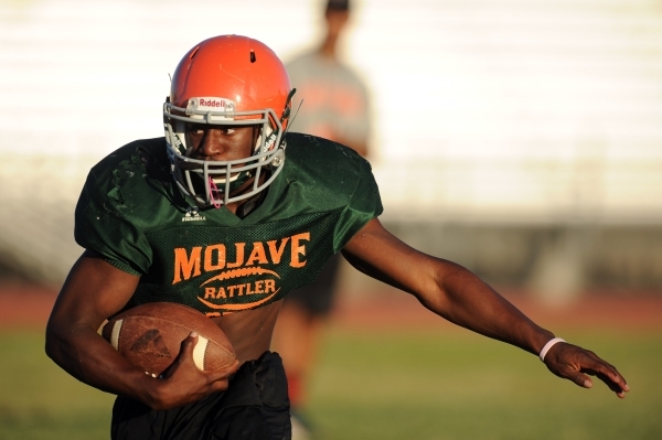 Mojave Rattlers linebacker Blake Fitzgerald breaks free during football practice at Mojave H ...