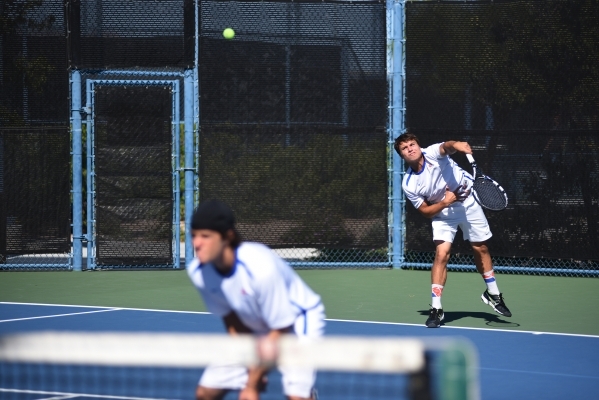 Sam Sholeft, 16, of Bishop Gorman High School serves the ball during the Sunset region tourn ...