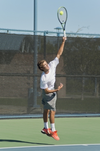 Dylan Levitt of Palo Verde High School serves during the Nevada state championship tennis to ...