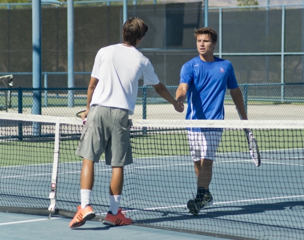 Sam Sholeff, right, and Dylan Levitt shake hands after their match during the Nevada state c ...
