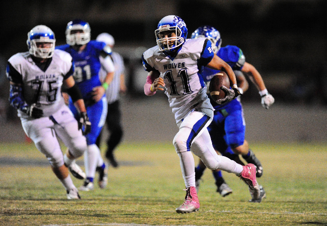 Basic Wolves quarterback Aeneas McAllister (11) scores a touchdown against Green Valley in t ...