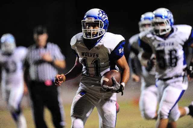 Basic Wolves quarterback Aeneas McAllister (11) scores a touchdown against Green Valley in t ...