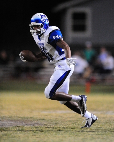 Basic Wolves wide receiver Harris Frank (16) looks for running room after catching a pass fo ...