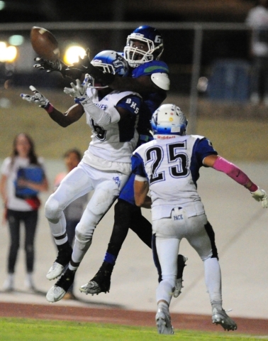 Basic Wolves cornerback Deondre Ishman (6) breaks up a pass intended for Green Valley Gators ...