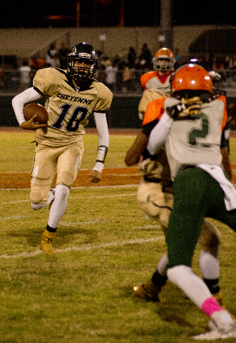 Cheyenne&lsquo;s Anthony McConnico (10) runs the ball up field during their prep football ga ...