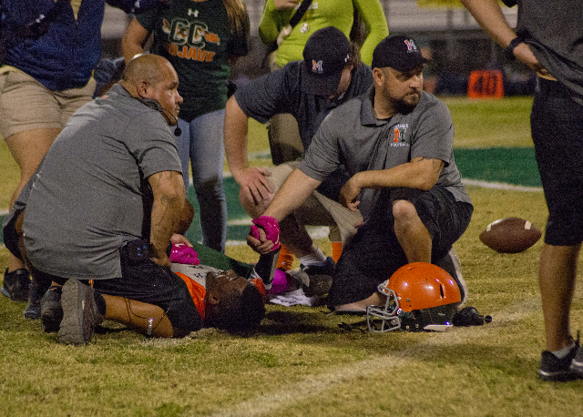 Mojave running back Elijah Smoot (3) lies injured on the field during their prep football ga ...