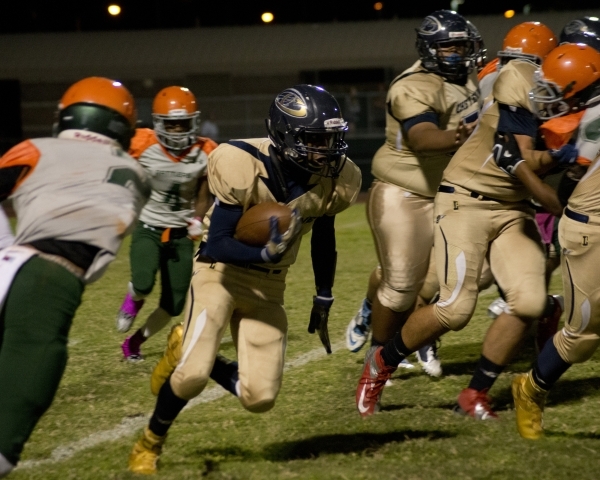 Cheyenne&lsquo;s Corwin Bush (6) runs the ball during their prep football game at Mojave Hig ...