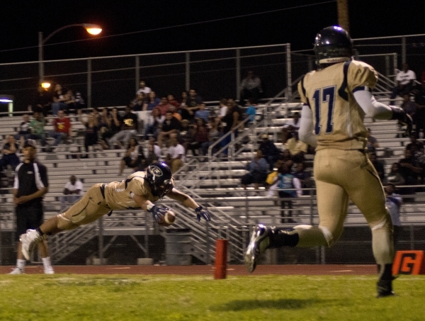 Mojave&lsquo;s George Carmona (42) dives for a touchdown during their prep football game at ...