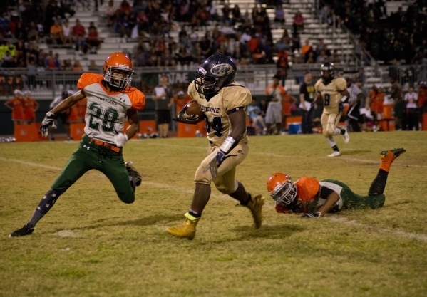 Cheyenne&lsquo;s David Walker (34) breaks tackles during a run downfield during their prep f ...