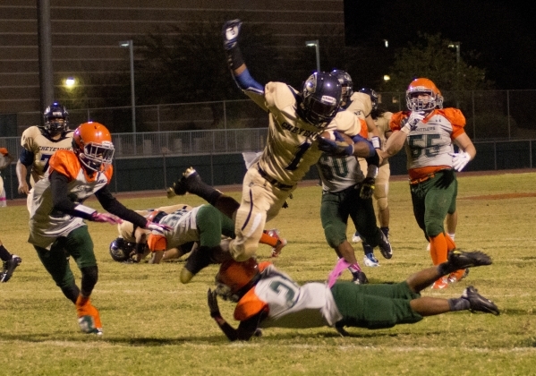 Cheyenne‘s Kamareeon Counts (1) leaps for extra yardage during their prep football gam ...