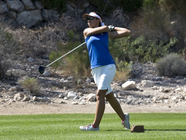 Hunter Pate, of Bishop Gorman High School, hits her ball during the Sunset Region golf tourn ...