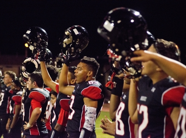 Las Vegas High School payers cheer on their team during their prep football game against Can ...