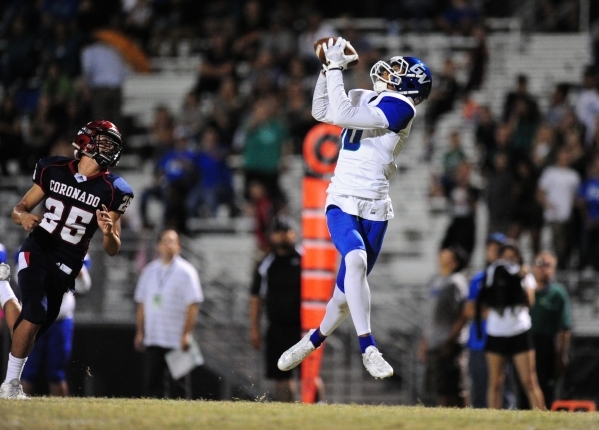 Green Valley Gators wide receiver Isiah Macklin catches a touchdown pass in front of Coronad ...