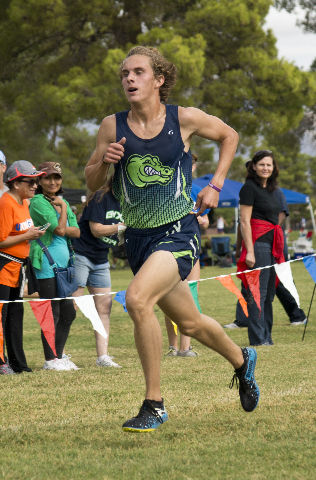 Austin Rogers, of Green Valley High School, runs toward the finish line during the Cross Cou ...