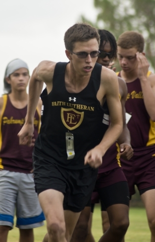 Chase Wood, of Faith Lutheran High School, practices his race starts during the Cross Countr ...